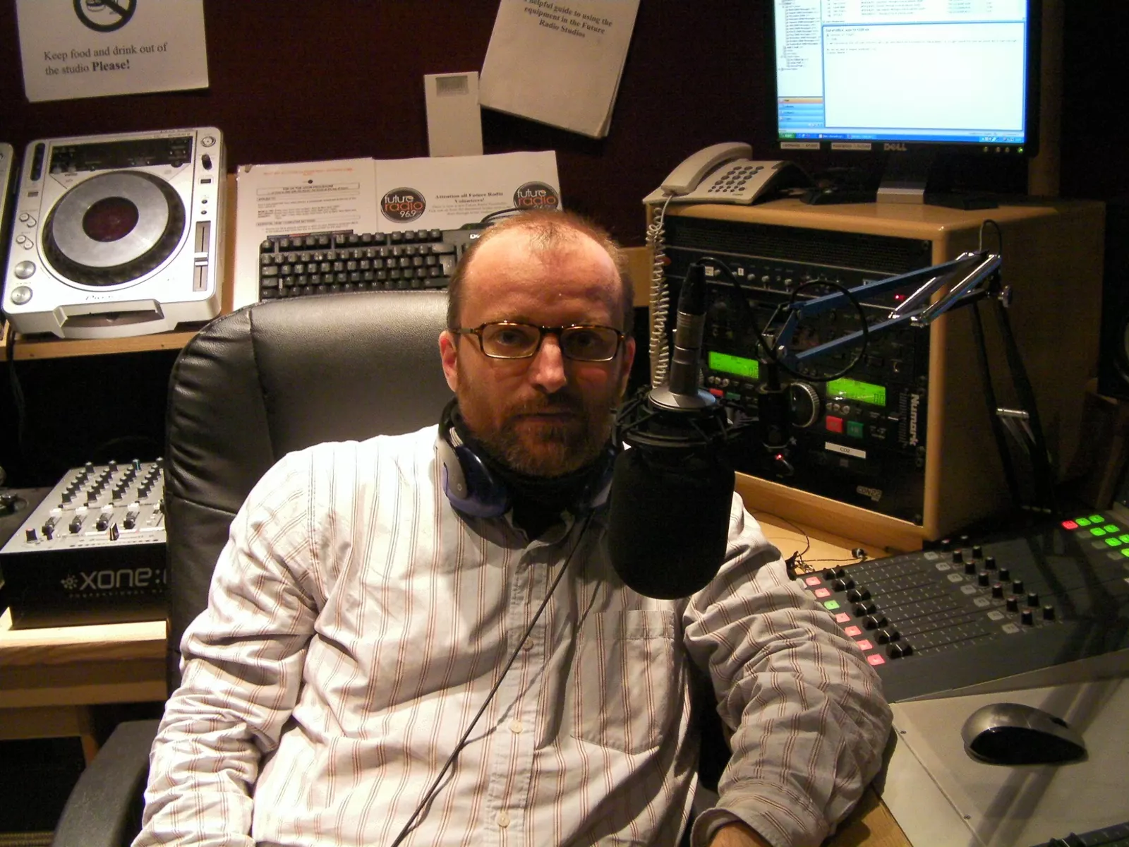 Dominik at the Future Radio microphone and mixing desk